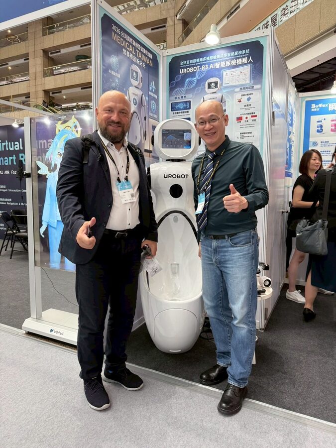 A medical-device company representative from Australia in discussion with the founder