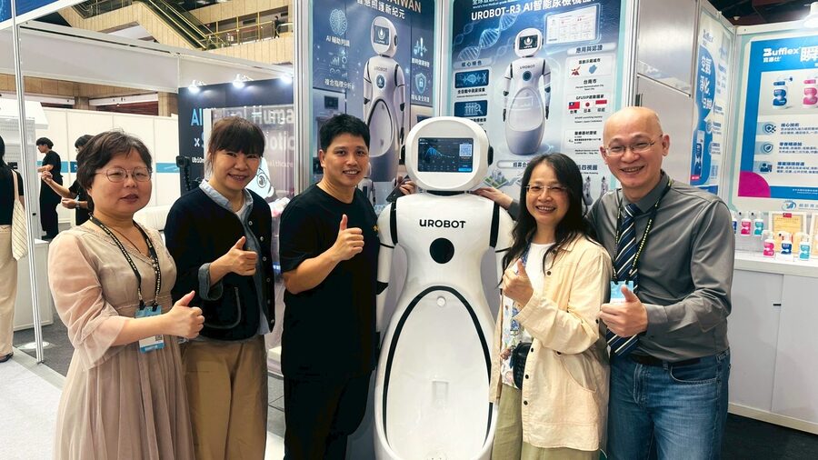 Visitors posing with members of the founding team